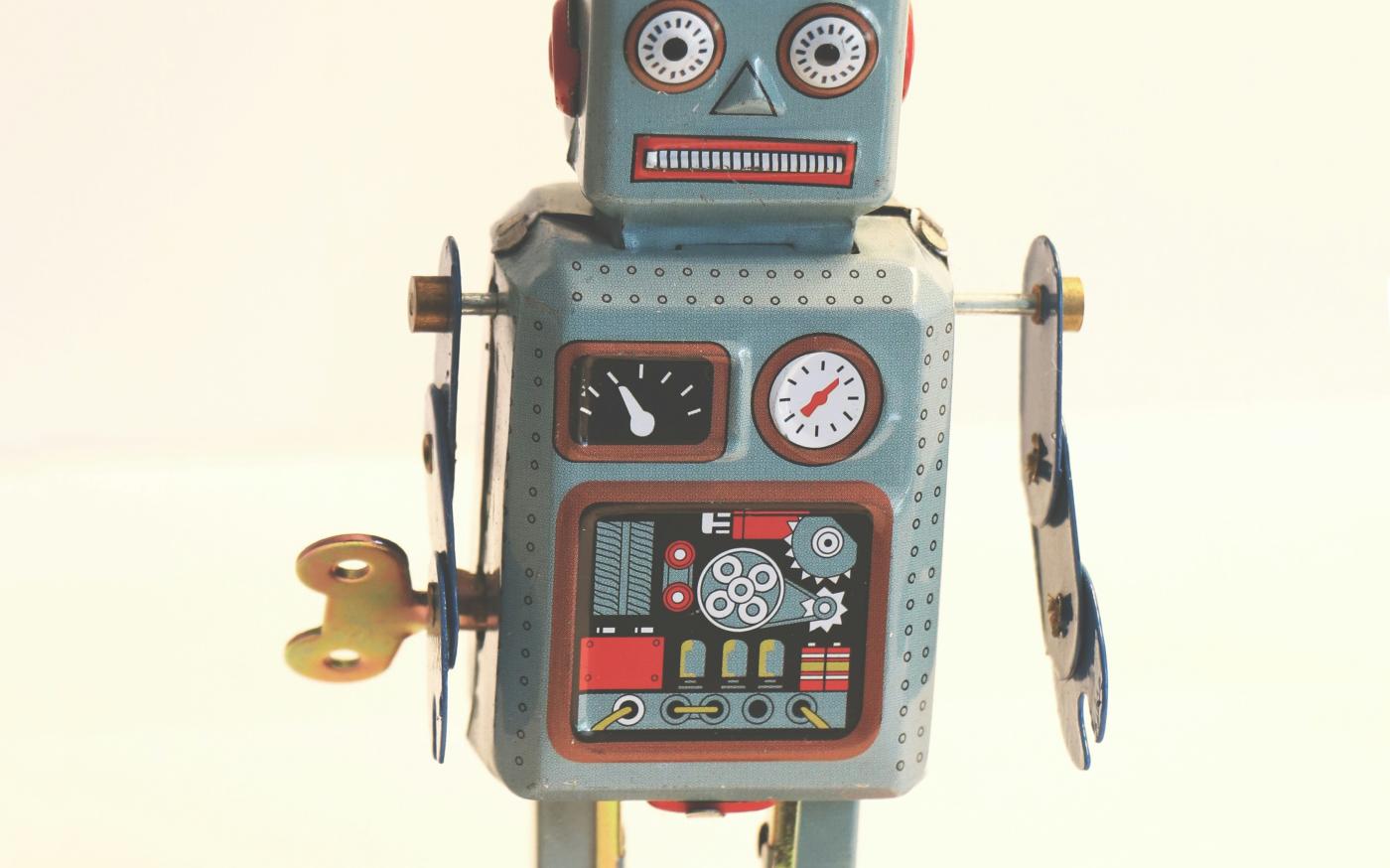gray and white robot illustration by Emilipothèse courtesy of Unsplash.
