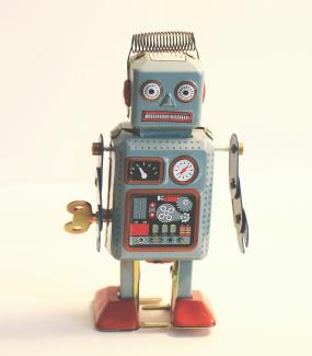 gray and white robot illustration by Emilipothèse courtesy of Unsplash.