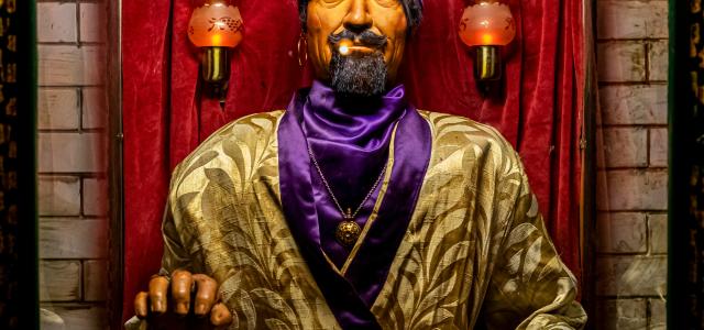 man in gold and brown robe holding black and silver dslr camera by Hulki Okan Tabak courtesy of Unsplash.
