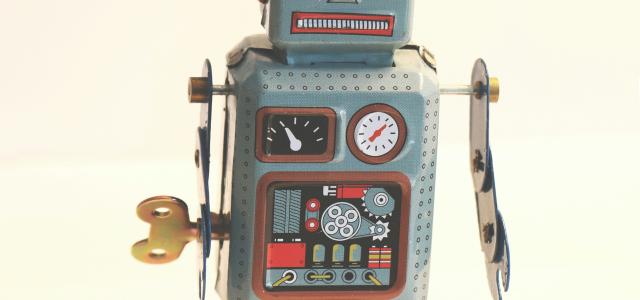 gray and white robot illustration by Emilipothèse courtesy of Unsplash.