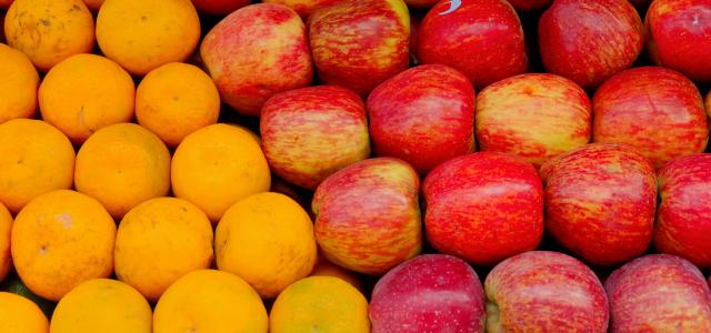 a pile of apples and oranges sitting next to each other by Gowtham AGM courtesy of Unsplash.